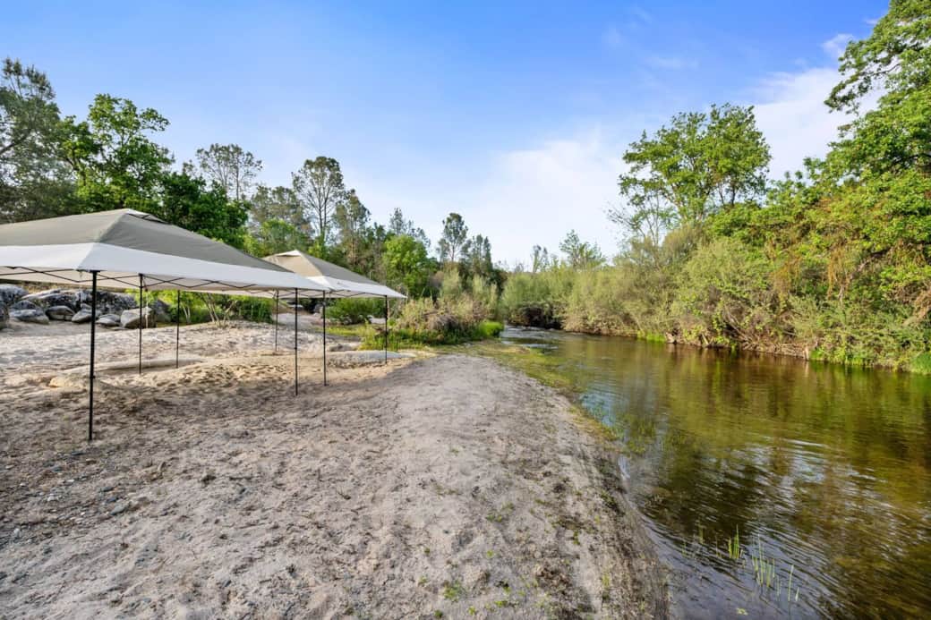 Enjoy the white sand beach and a beautiful river! Perfect for everyone to relax in!