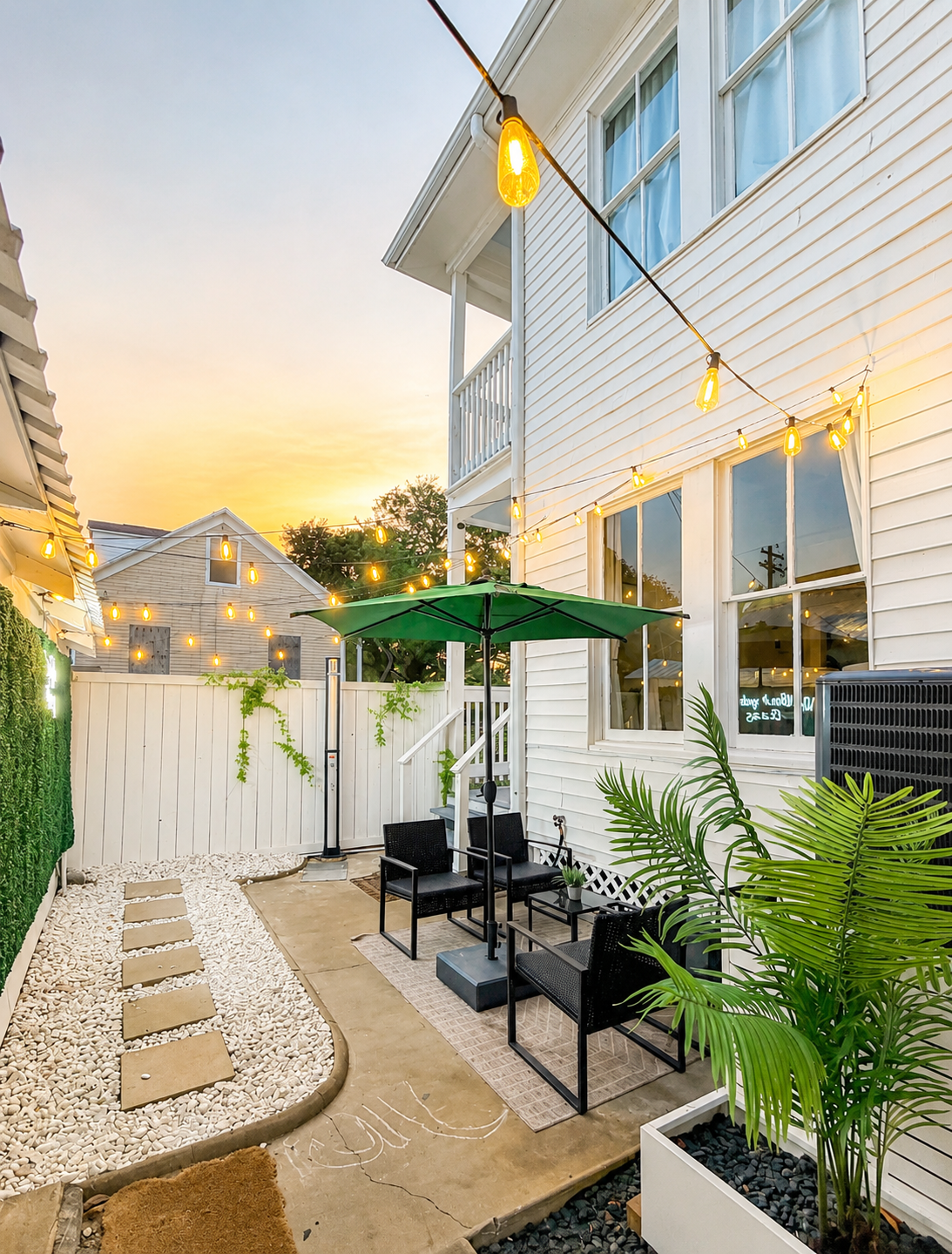 Private courtyard and photo wall at White Magnolia Galveston