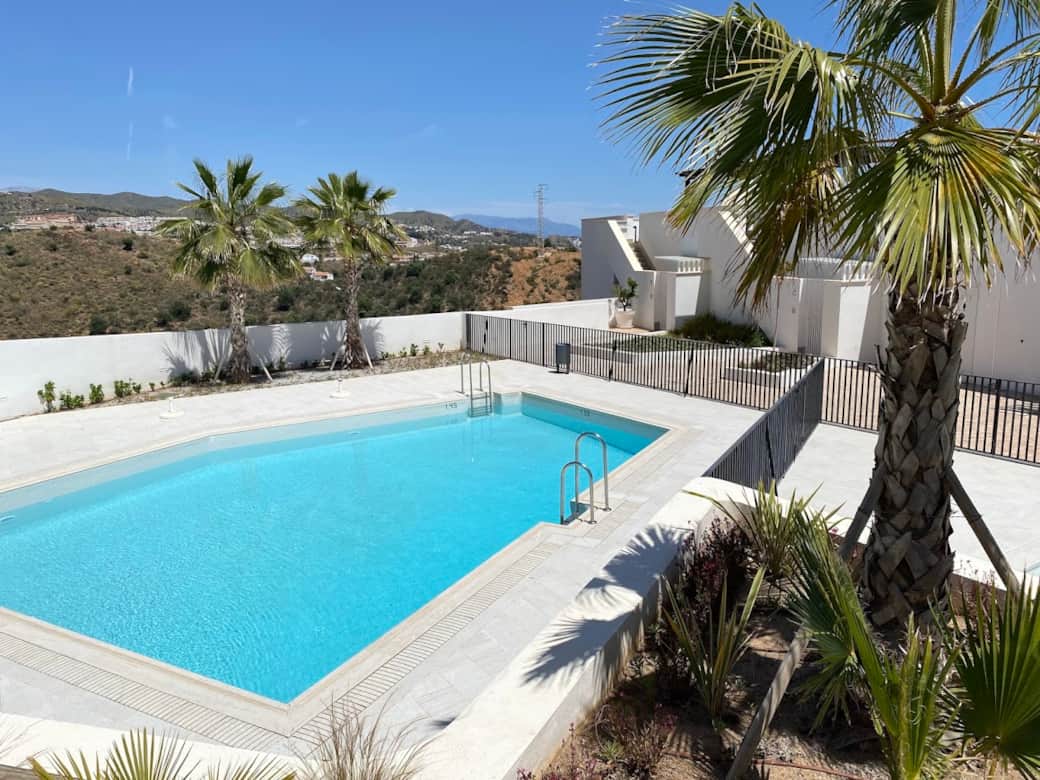 Take a refreshing swim in the saltwater pool right in front of the apartment