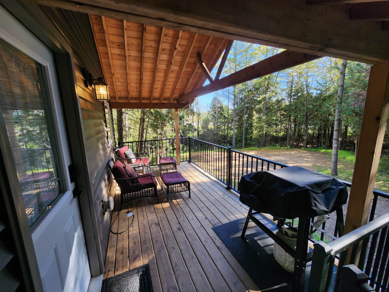 Cabin 3 deck in morning facing parking area.