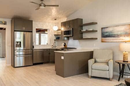 The kitchen and living room are open and airy.