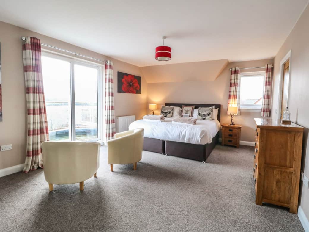 Bedroom 1 with queen-size bed and ensuite