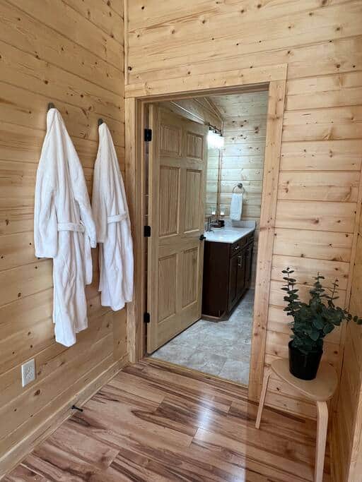 Ensuite bathroom with luxe robes, towels, and toiletries