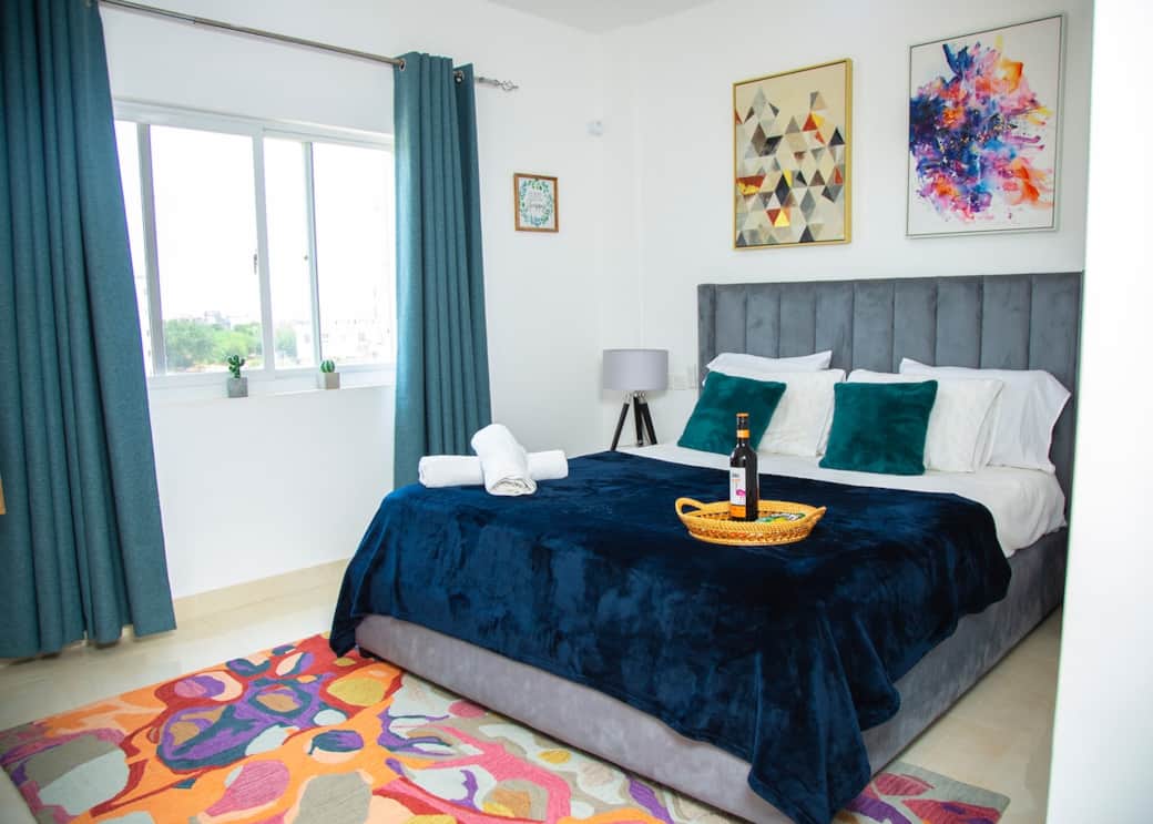 Your serene sanctuary awaits: Unwind in our spacious master bedroom where comfort meets elegance. Experience restful nights and rejuvenating mornings in style!