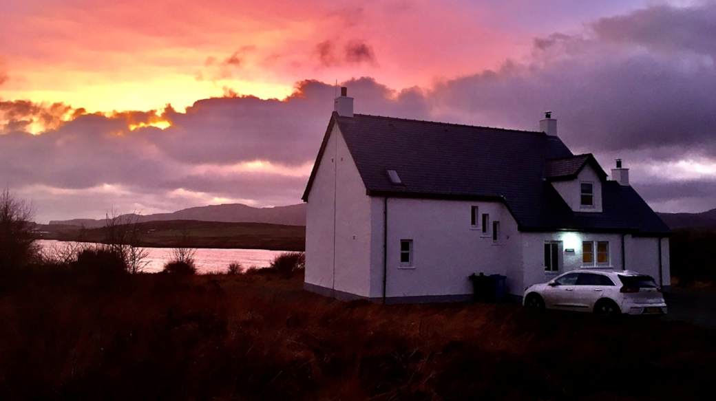 Sunset over Healabhal Cottage and Loch Caroy