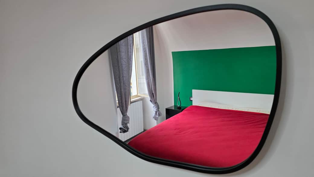 Modern, minimalist mirror for the bedroom at Agli Archi Eco House in Chieti