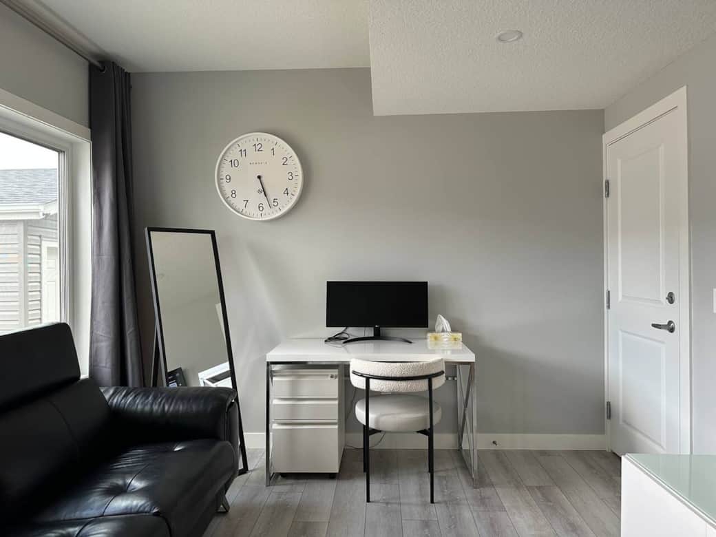 Bright and modern living space with a sleek Murphy bed, smart storage, a cozy desk setup, and comfortable seating. Perfect for relaxing, working, or enjoying a quiet night in.