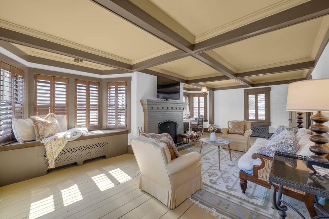 Second Sitting Room with working fireplace and quiet desk, overlooking the garden
