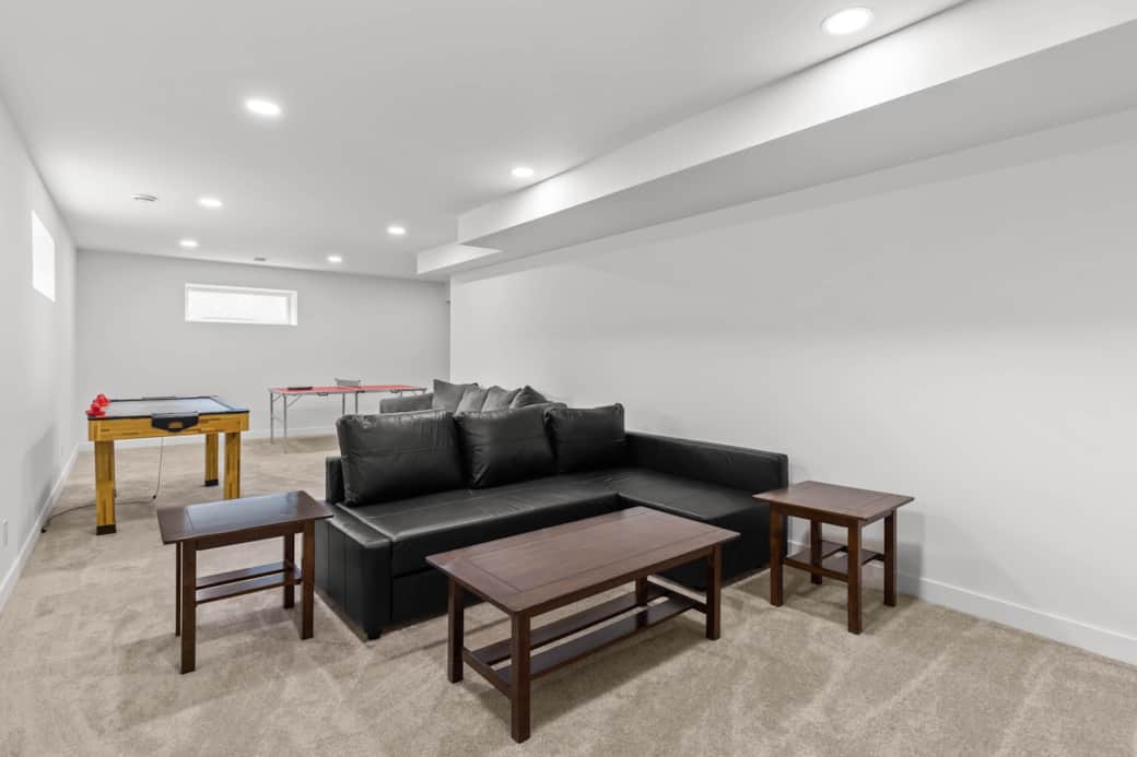 Games room with 65" tv in basement