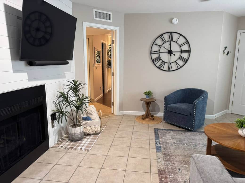 Living room with 65" Vizio Smart TV and fireplace