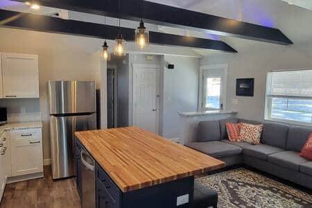 Large open concept kitchen and eat-at Cherry butcher block counter island