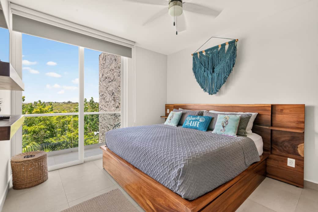 Rest easy in a king bed with A/C, ceiling fan, blackout shades, and a private jungle-view balcony.
