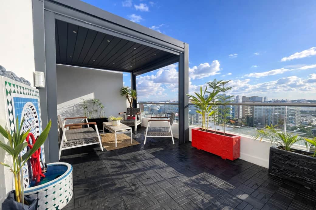 Spacious terrace lounge with modern furniture and panoramic skyline views, ideal for sunny afternoons or evening gatherings. Spacious terrace lounge with modern furniture and panoramic skyline views, ideal for sunny afternoons or evening gatherings.