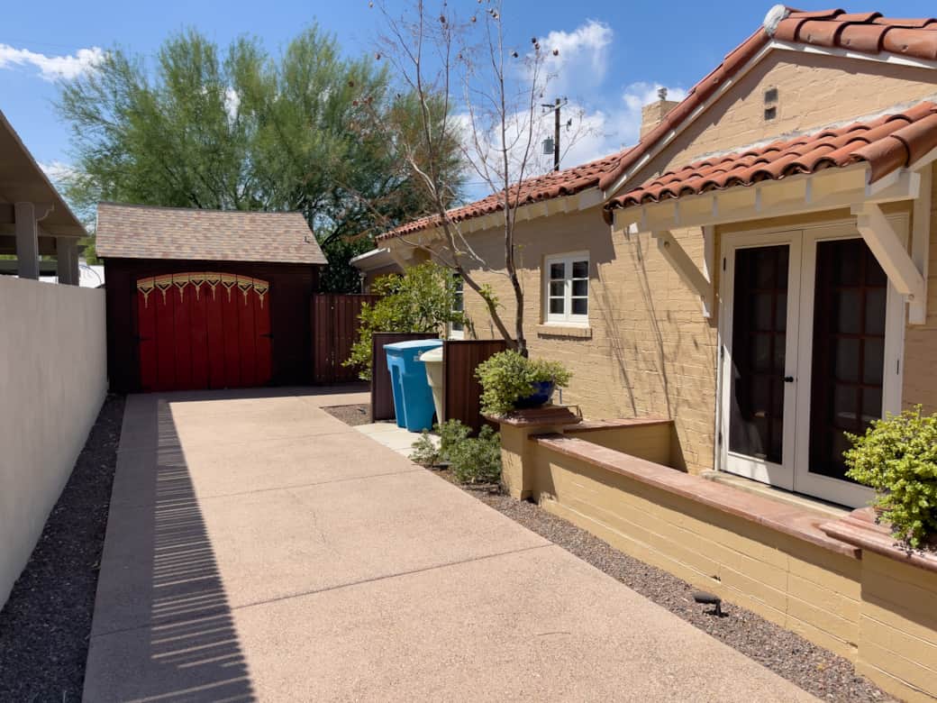 View of driveway and side view of home. View of driveway and side view of home.