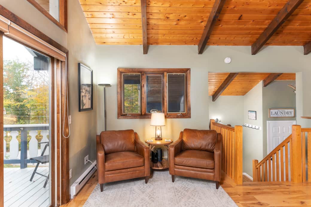 A cozy, corner reading nook offers space for a quiet morning cup of coffee or an evening cocktail.