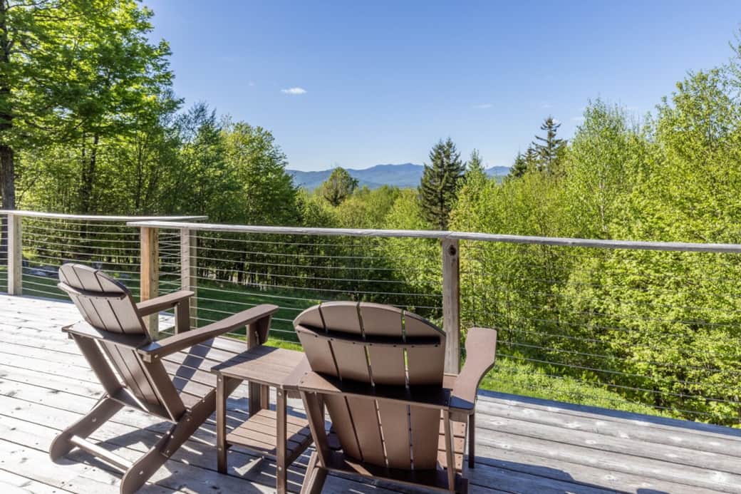 Relax on a private deck with sweeping forest views and Mount Mansfield views. Perfect for morning coffee or sunset unwinding