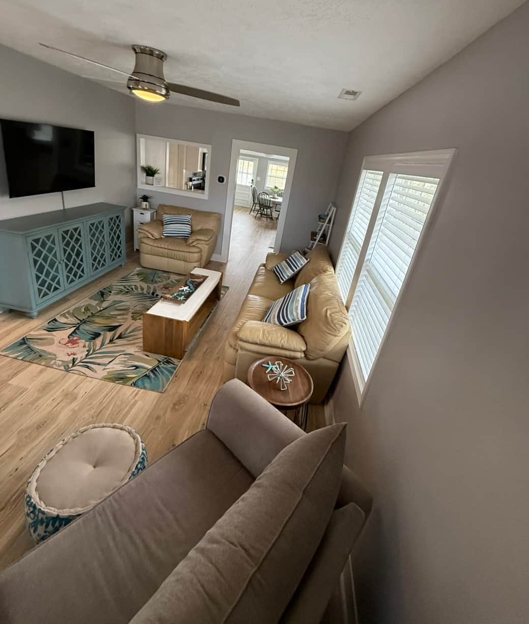 Living room with comfy couch, TV and two oversized chairs. One pulls out into twin bed. Living room with comfy couch, TV and two oversized chairs. One pulls out into twin bed.