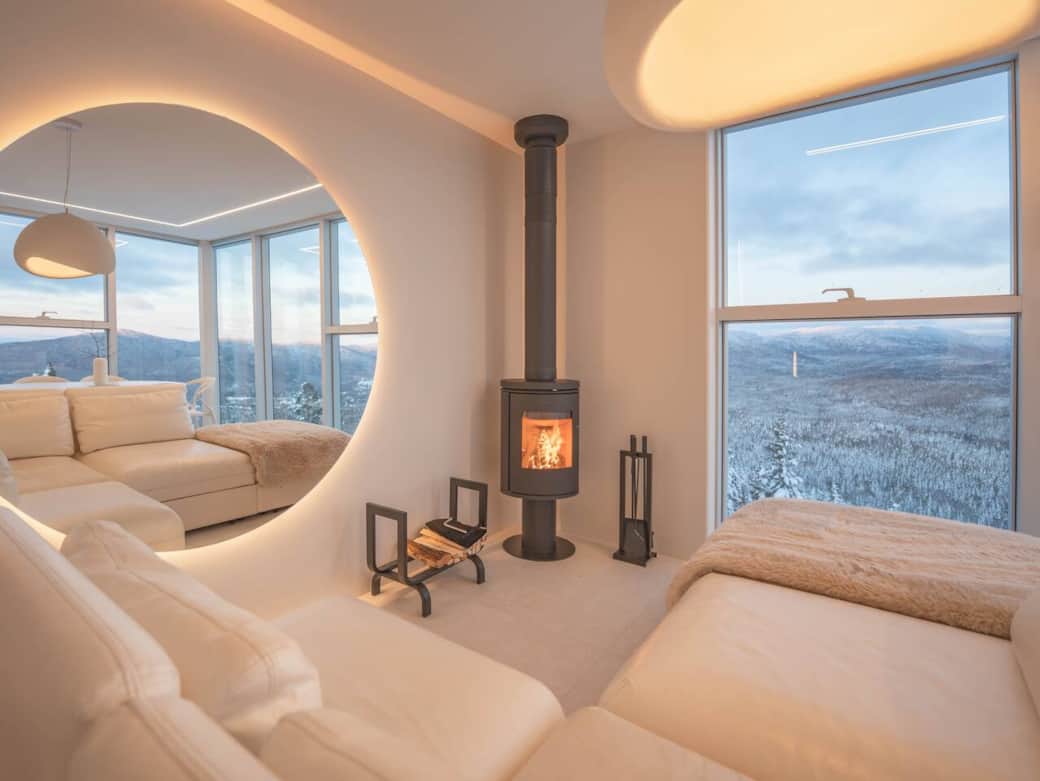 Wood-burning fireplace in an open-concept living area