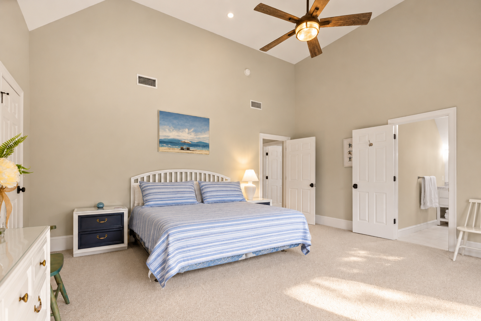 Rest under the striped bedspread and step into the ensuite bathroom nearby.