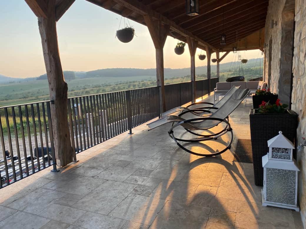 Enjoy a glass of local red wine in the evening sun