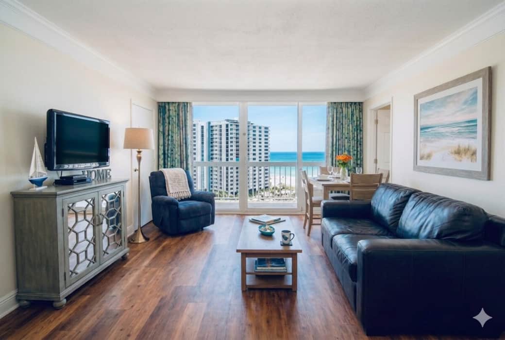 Unwind in our bright and airy living area, designed with a classic beach-inspired aesthetic. Featuring comfortable seating, a flat-screen TV, and a warm, inviting atmosphere, it is the perfect spot to kick back after a day on the sand. Unwind in our bright and airy living area, designed with a classic beach-inspired aesthetic. Featuring comfortable seating, a flat-screen TV, and a warm, inviting atmosphere, it is the perfect spot to kick back after a day on the sand.