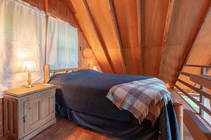 Queen sized bed in the loft.