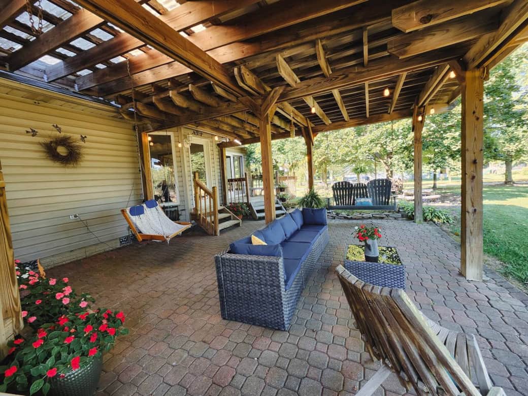 The covered patio provides plenty of outdoor seating.