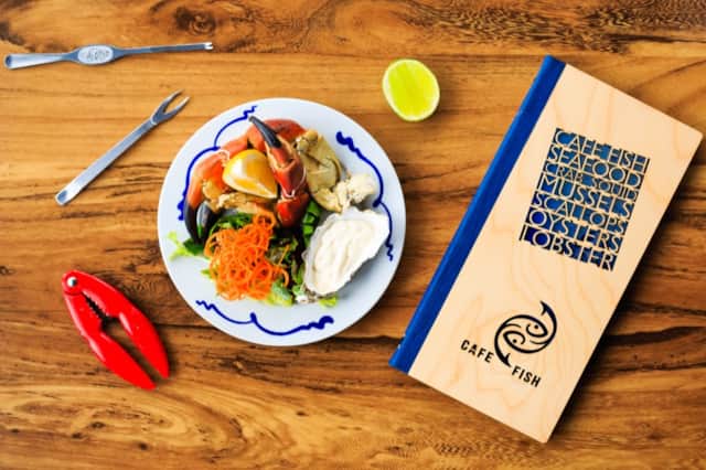Seafood platter and wooden menu at Cafe Fish in Tobermory