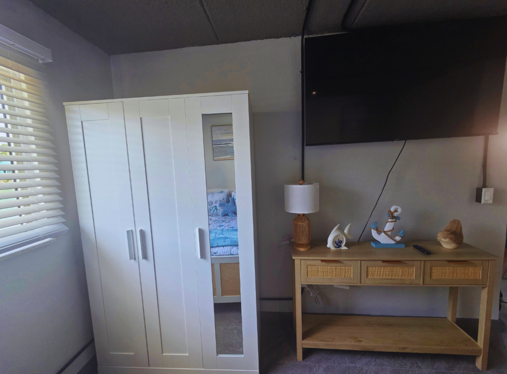 Smart TV with Netflix included and a spacious closet for added comfort. Treasure Island, FL