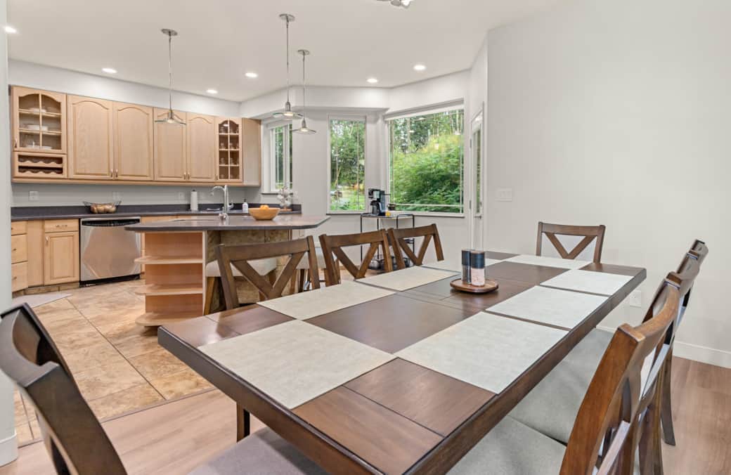 Bright dining room with seating for the whole group and natural light.