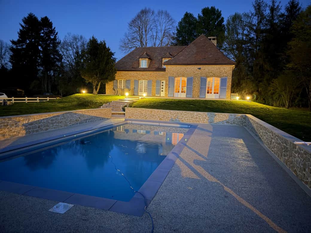 Magical evening view of private pool at Dordogne holiday villa