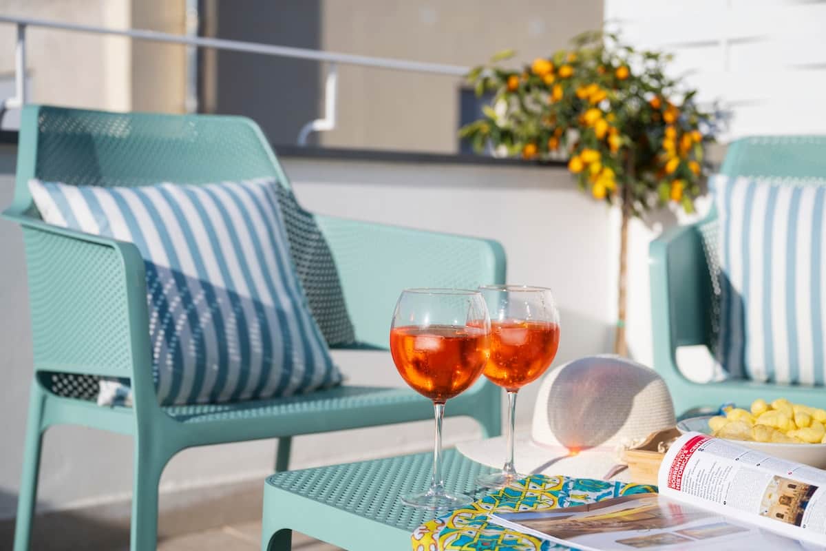 Private terrace with sun loungers, lounge area and outdoor shower in central Sorrento