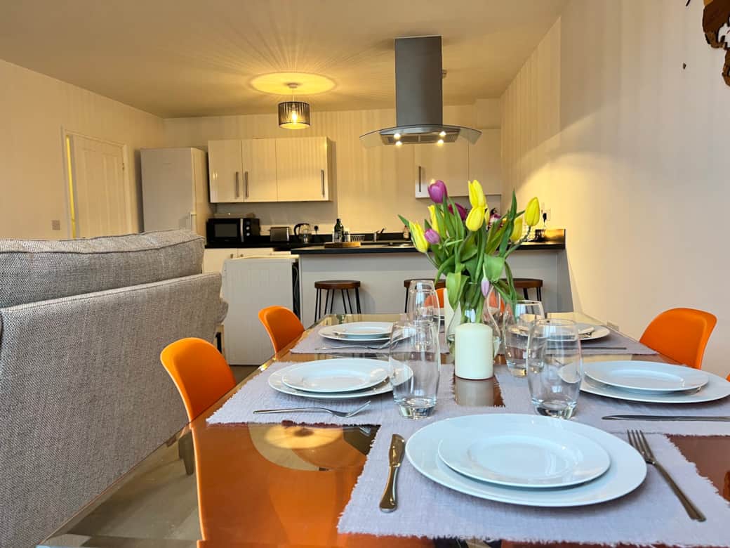 Dining Room: Bright colorful accents paired with stylish decor create the perfect dinner vibe!