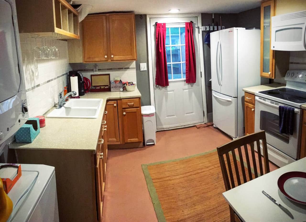 Now, head into the Kitchen where you'll find not only a FULL sized Samsung Fridge to store your leftovers, but also a stackable GE washer & dryer with detergent and dryer sheets provided!