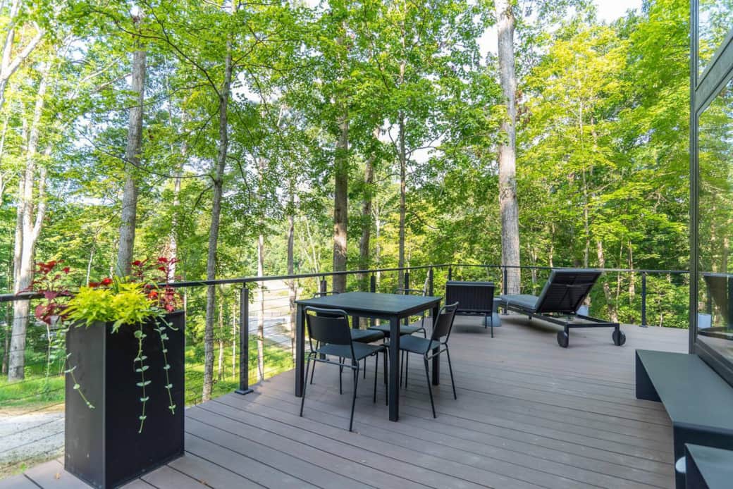 The Hemwood's multiple outdoor seating options on the deck provide spaces for al fresco dining, relaxing, reading, or enjoying a cup of coffee or glass of wine in the woods.