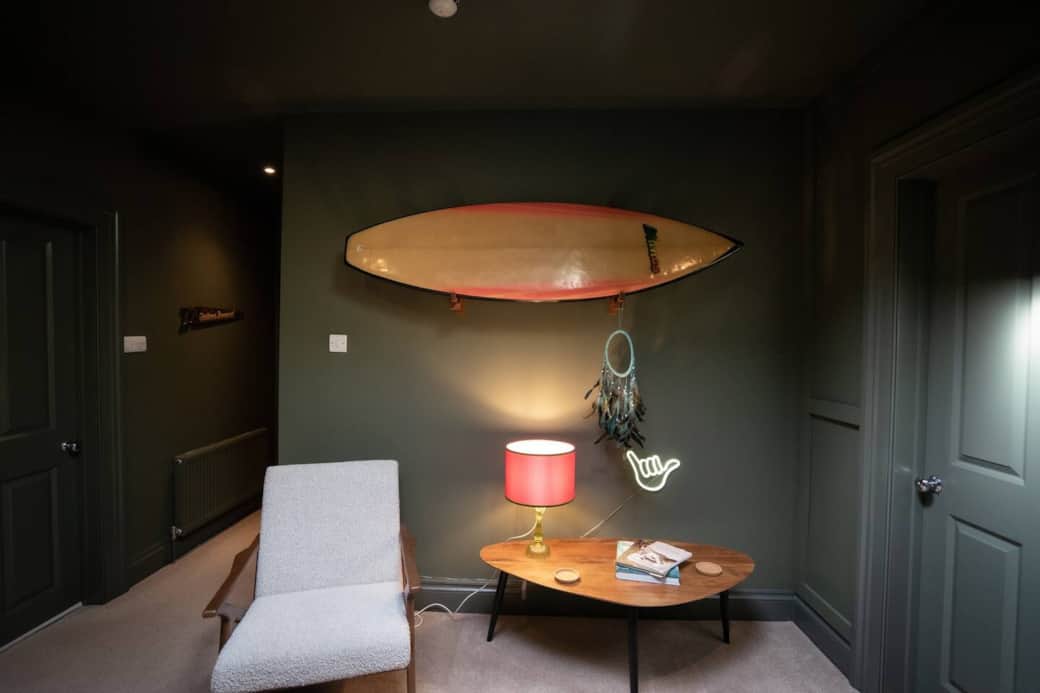 Spacious hallway seating area with vintage surf inspired vibe.