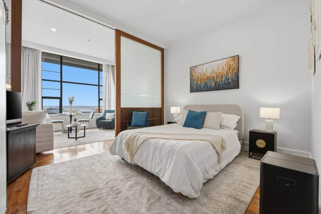 View of the bedroom with queen bed and TV through to the lounge area View of the bedroom with queen bed and TV through to the lounge area