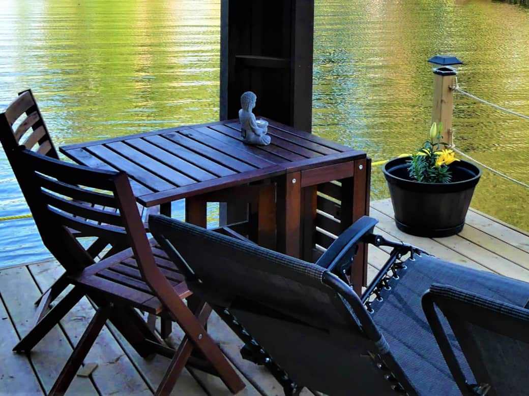 Private floating terrace with table, chair and sun loungers Private floating terrace with table, chair and sun loungers