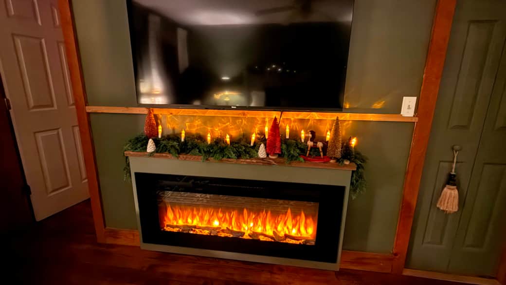 King Suite electric fireplace and large screen TV.