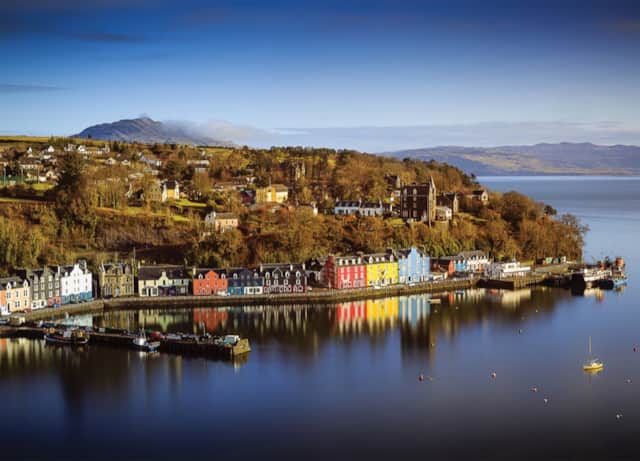 Tobermory’s colourful waterfront and boats reflected in the harbour