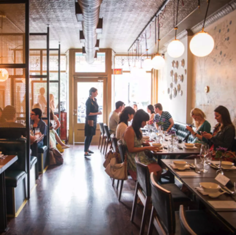 Interior view of Dailo, a notable restaurant in Toronto, situated conveniently close to Posh Digs homes. This image captures the inviting ambiance of the restaurant, highlighting its appeal to guests staying in the nearby short-term rentals.