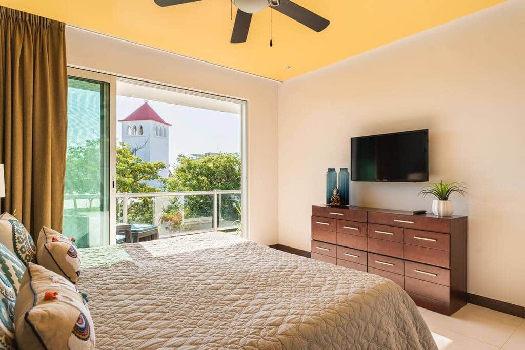 Another view from the primary bedroom to the balcony with views of the church