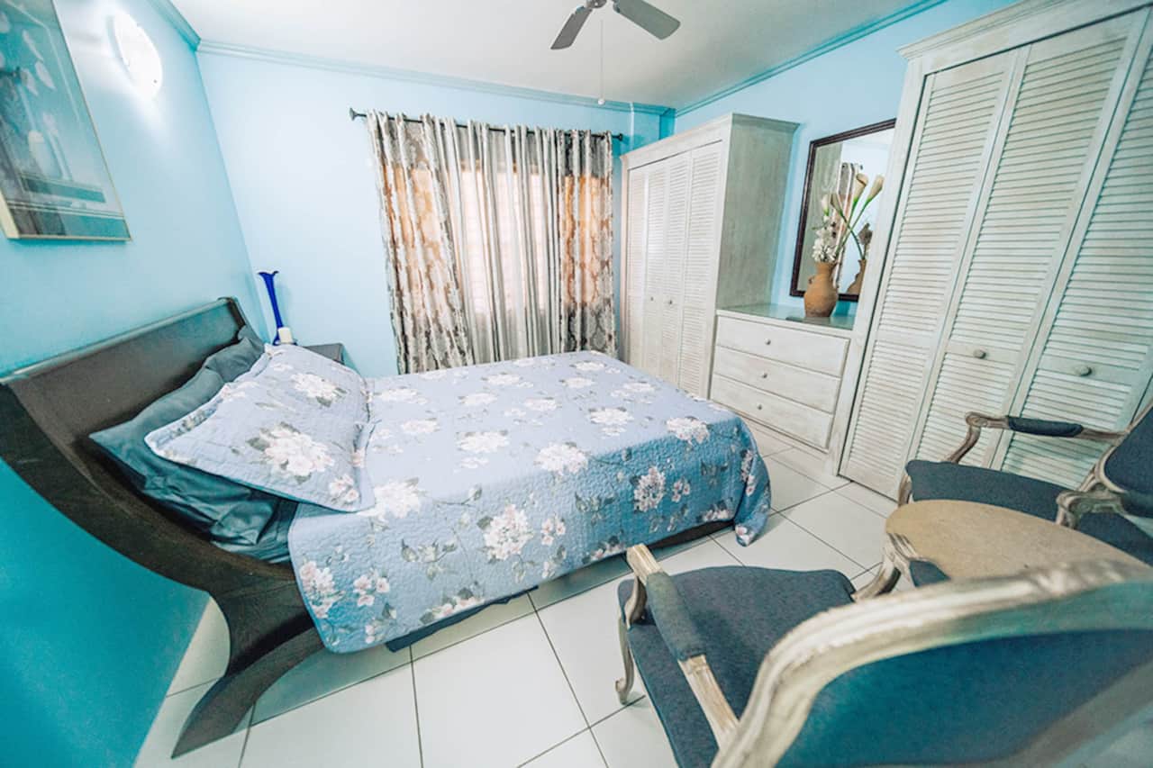 Master bedroom with a spacious queen bed.