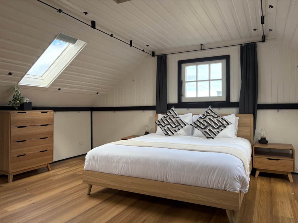 Spacious, light-filled loft with king bed and lounge area - perfect for relaxing or working.