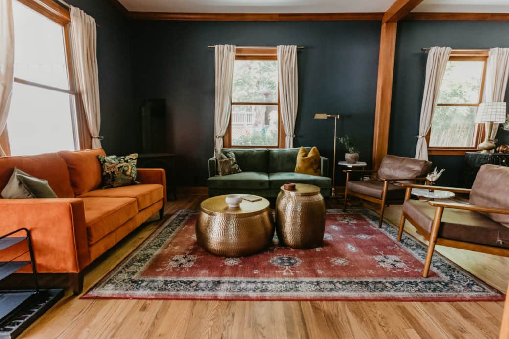 Enjoy the comfortable living room with velvet couches and leather arm chairs