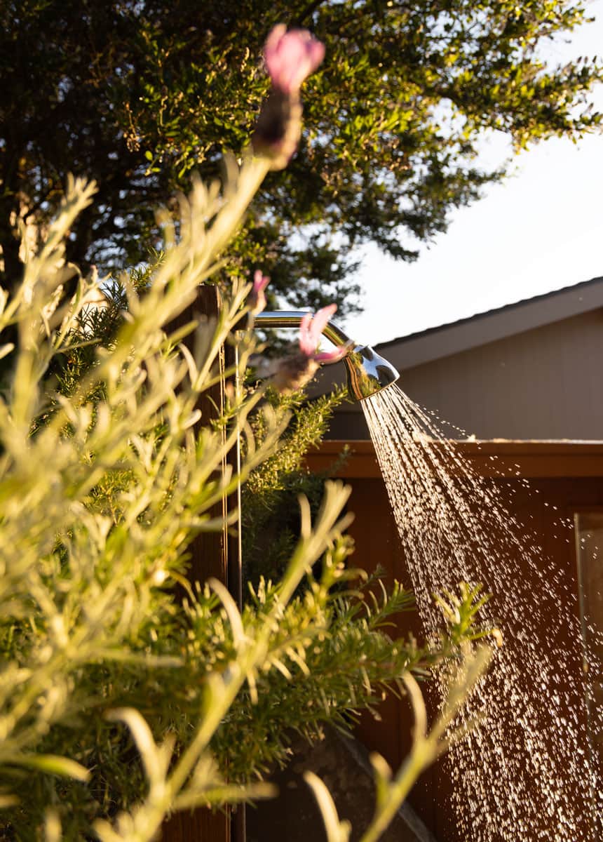 Walls of Glass outdoor shower. Both properties have one.