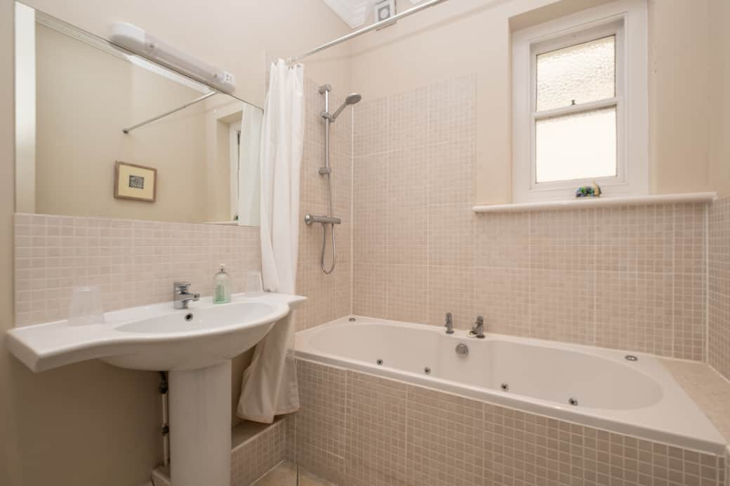 Bathroom with shower over bath