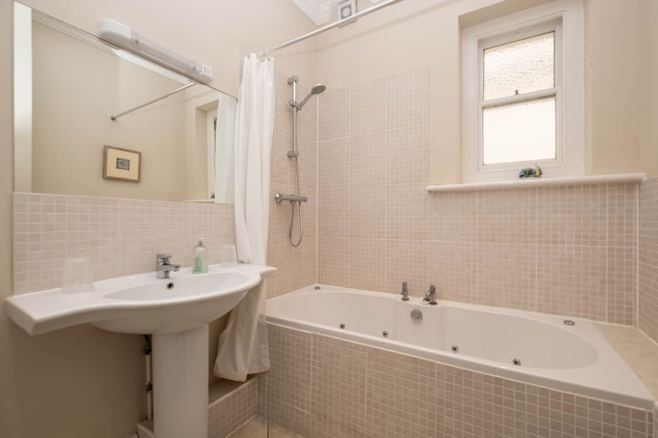 Bathroom with shower over bath