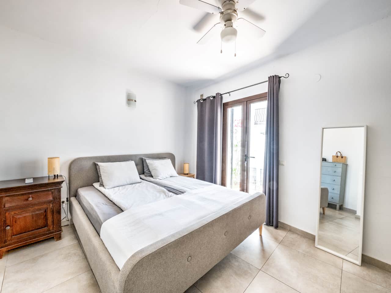 Bedroom 1 with access to the lower terrace