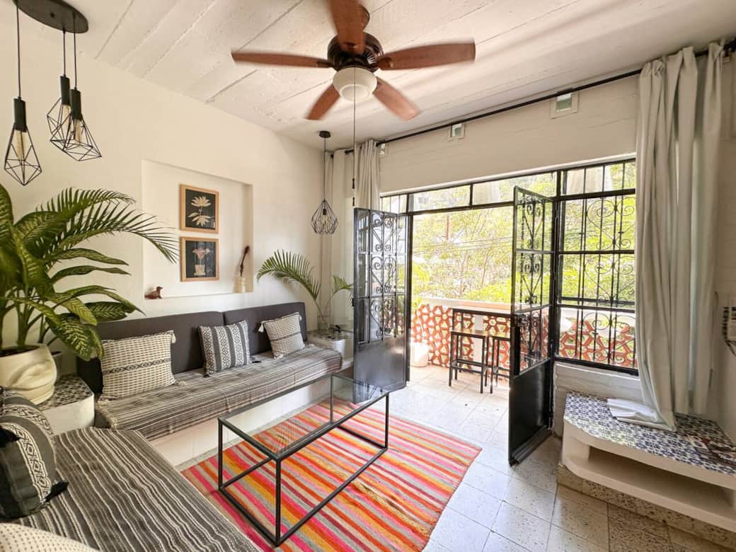 Bright living room opens to a private terrace with indoor-outdoor flow — perfect for morning coffee, fresh air, and relaxed evenings at home.